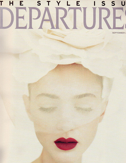 Model in veiled hat on cover of Departure Magazine