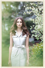 model in garden setting wearing darby scott silver colored chemise dress