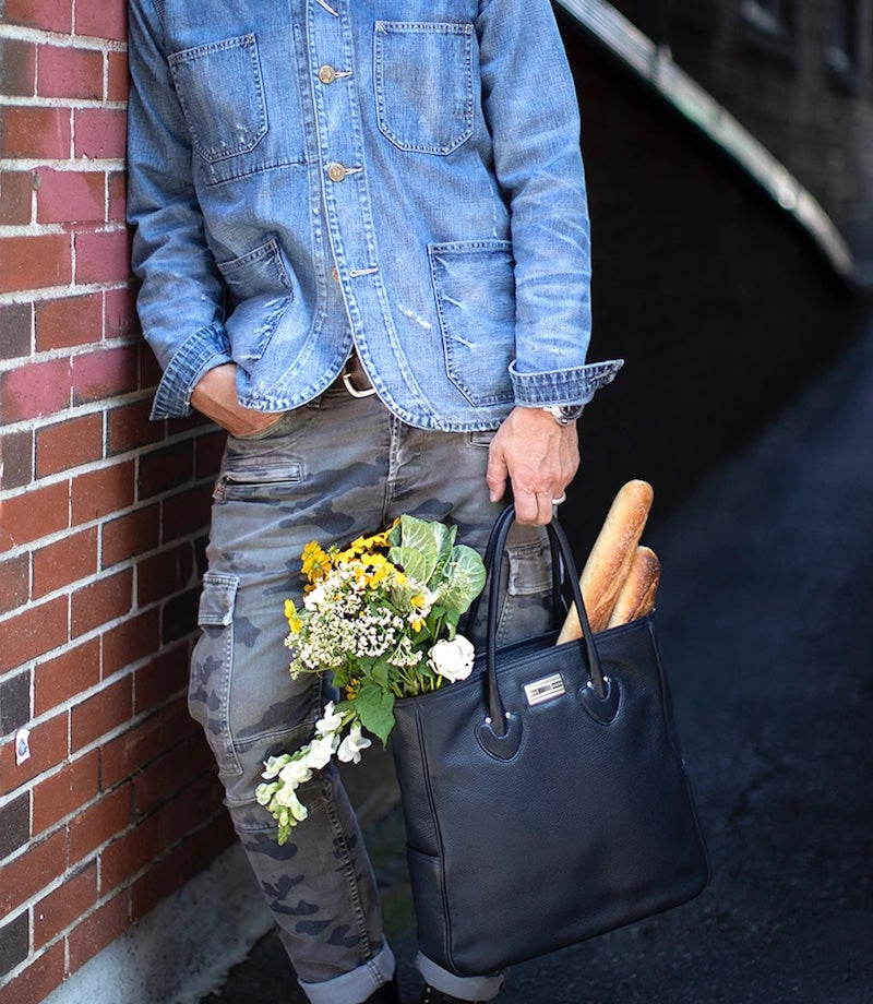 Man holding a Navy Essex Tote filled with flowers and baguettes - Darby Scott