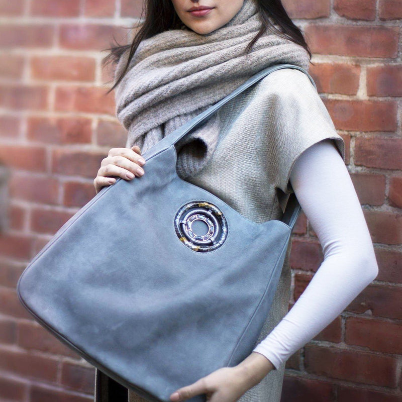 Paige Hobo in Denim Blue Suede carried by model