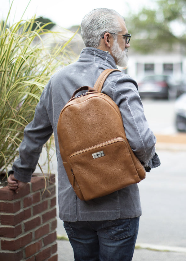 Darby Scott model with cognac leather backpack