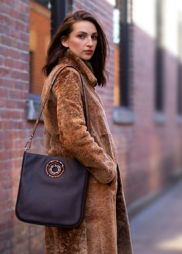Model with chocolate leather Cloe Cross Body Tote - Darby Scott