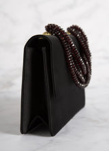 Side view of Black Peau de Soie and Garnet Necklace Handbag - Darby Scott