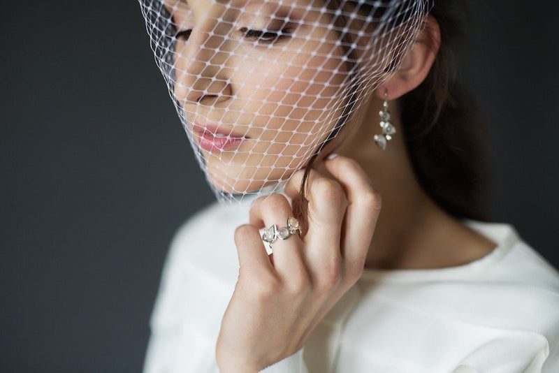 A bride with veil wears Moonstone & Diamond Sterling Mosaic Ring & Earrings - Darby Scott