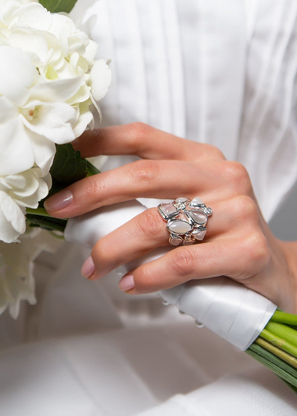 Moonstone & Diamond Sterling Cocktail Ring shown on hand of model holding a bouquet - Darby Scott