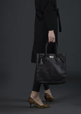 Model carrying Brown Leather Essex Tote - Darby Scott