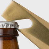 Bottle opener on bottle cap 