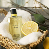 Basket with wash cloth, lemon and lemon eau de parfum bottle