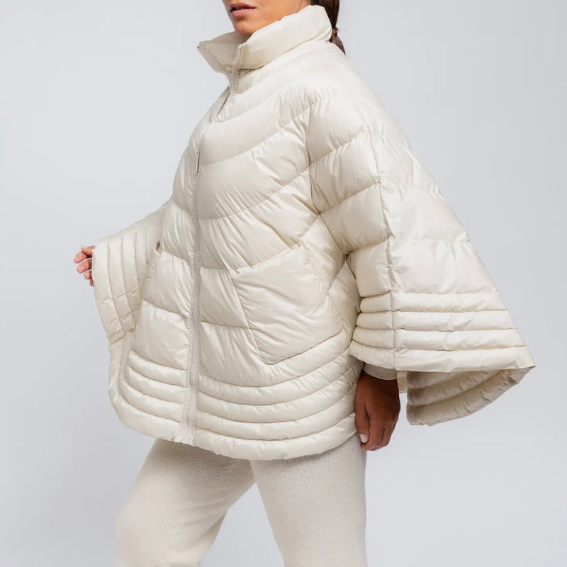 Ivory puffer cape on model