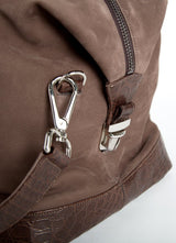 Close up of strap connector on light brown suede Aspen Travel Bag - Darby Scott