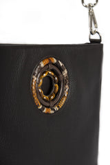 close up of tiger eye grommet stones on chocolate leather Cloe Tote- Darby Scott